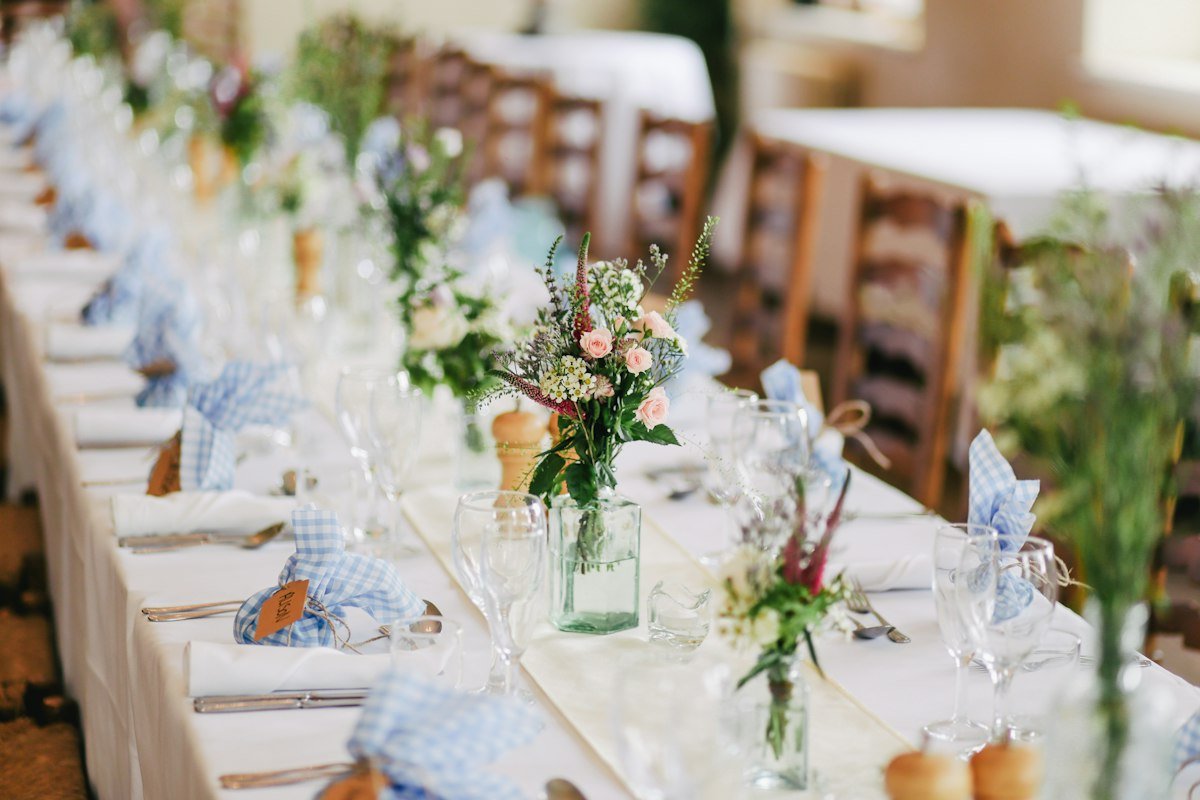 Wedding celebration table with fresh roses prepared for a Bloom bride